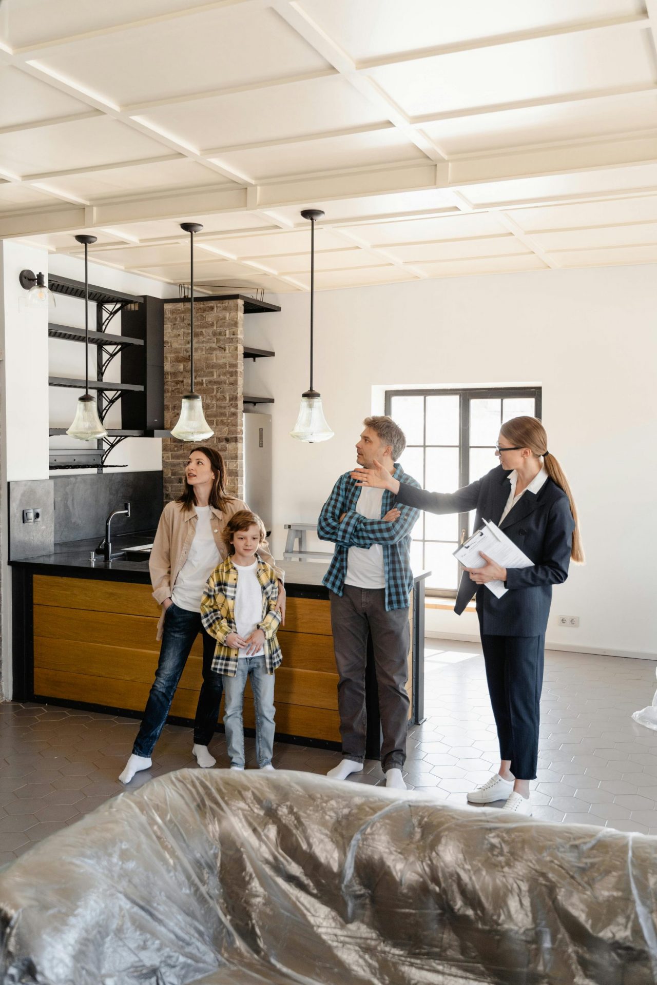 Real estate agent showing a house to a homebuyer